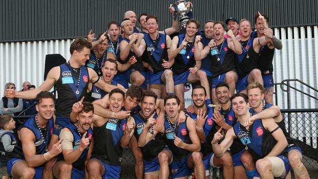 Uni Blues celebrate their 2019 VAFA flag. Picture: Hamish Blair