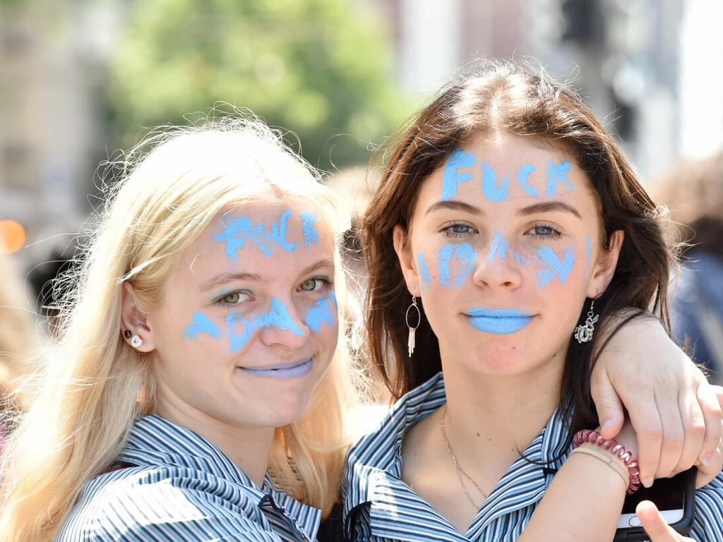 Elwood College students Li, 15, and Ruth, 15, with a not so subtle message for the PM. Picture: Jake Nowakowski