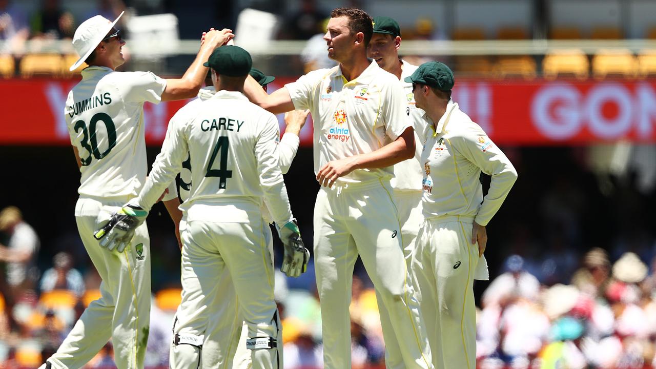 BRISBANE, AUSTRALIA - DECEMBER 11: Josh Hazlewood of Australia celebrates with wicket of Jos Buttler of England for 23 runs during day four of the First Test Match in the Ashes series between Australia and England at The Gabba on December 11, 2021 in Brisbane, Australia. (Photo by Chris Hyde/Getty Images)