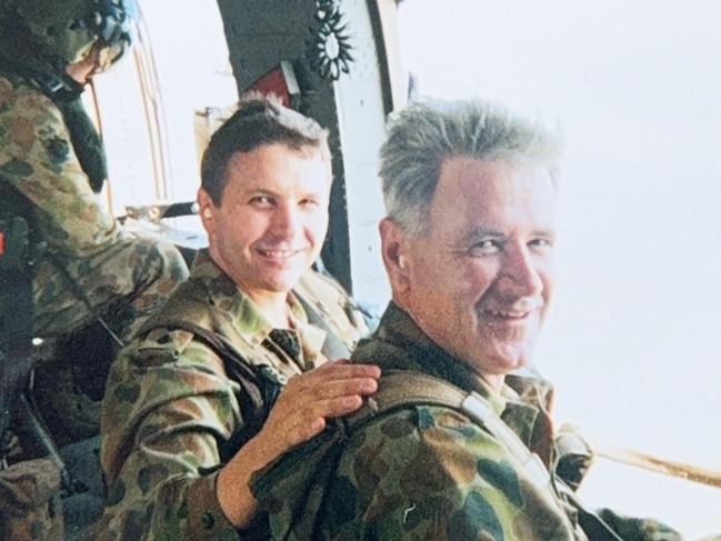 Bruce Armstrong in a Black Hawk helicopter with WO1 Mick Caughey OAM in East Timor in 2000. Bruce Armstrong, is now CEO of Aspen Medical, Picture: Supplied