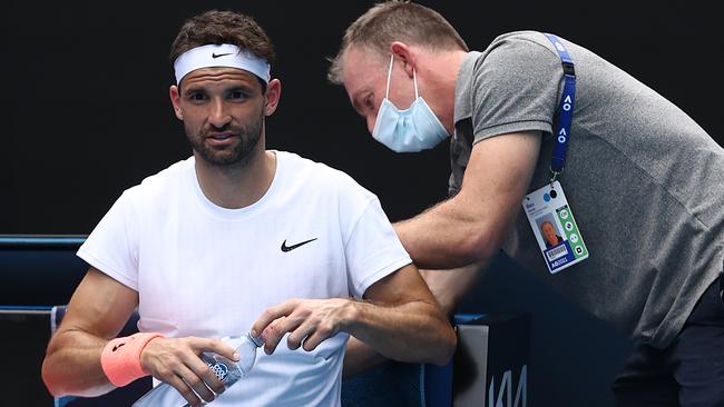 Grigor Dimitrov takes a medical timeout during the match. Picture: Getty Images