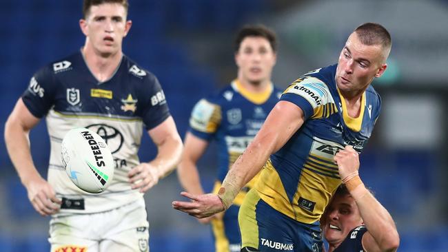 Eels skipper Clint Gutherson slips a pass away against the Cowboys. Picture: Chris Hyde/Getty Images