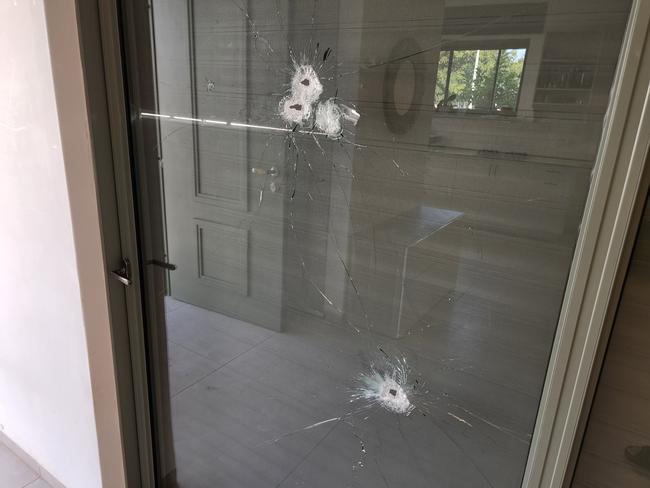 Bullet holes in the Tibon family’s living room window in Nahal Oz. Terrorists had fired into the house from the front porch; some of the bullets exited through a second window in the kitchen. Picture: Supplied