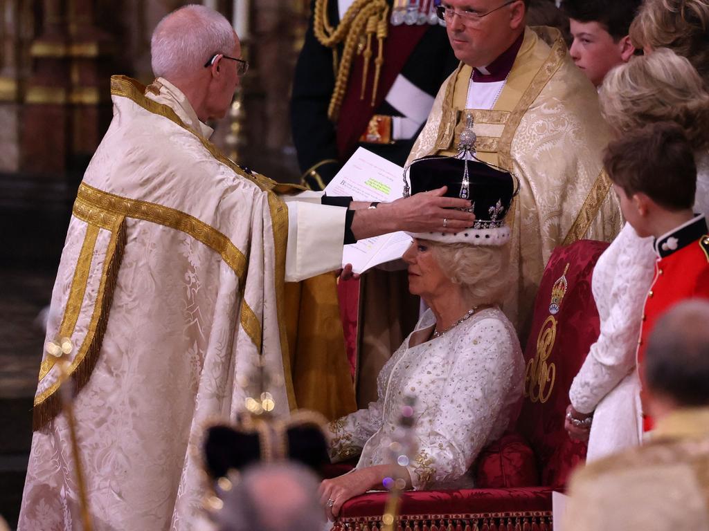 The Archbishop of Canterbury Justin Welby places a modified version of Queen Mary’s Crown onto the head of Camilla. Picture: Richard Pohle / POOL / AFP