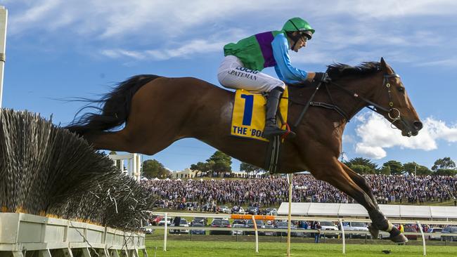 Postcard perfect: Steven Pateman and Zed Em race past the big crowd at The Bool. 