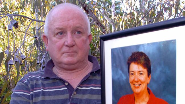 Don Scott, the widower of Margaret Tobin, with a portrait of the state’s slain mental health chief.