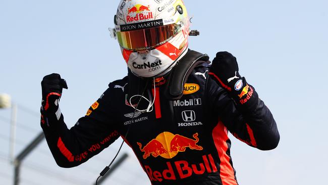 Red Bull driver Max Verstappen leaps from his car to celebrate victory. Picture: Getty Images