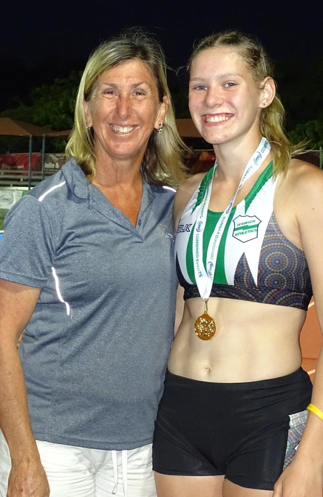 Ipswich and District Athletic Club record-breaker Charlize Goody receives her North Queensland Championships medal from 1984 Olympic heptathlon gold medallist Glynis Nunn. Picture: Vic Pascoe