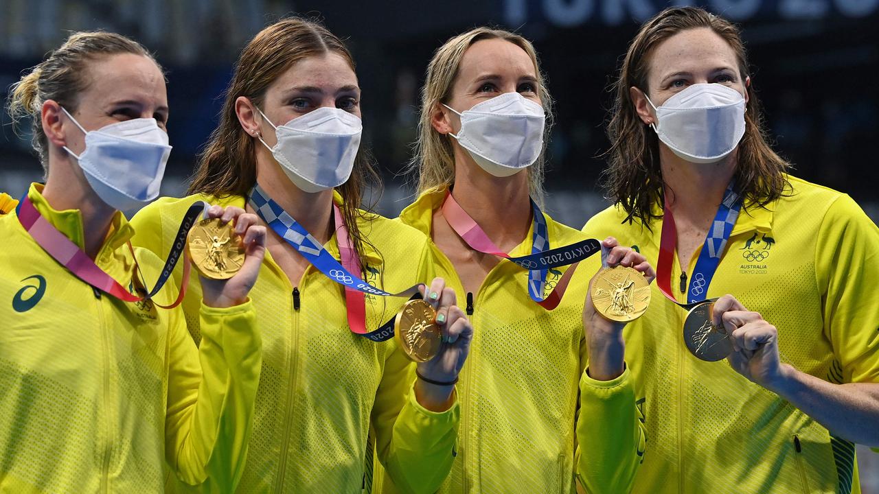 Our swimmers with their masks on after their gold medal win. Picture: AFP Photo