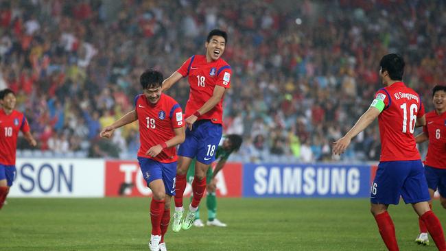 South Korea's Lee Jeonghyeop, right, celebrates with his team mate Kim Young Gwon.