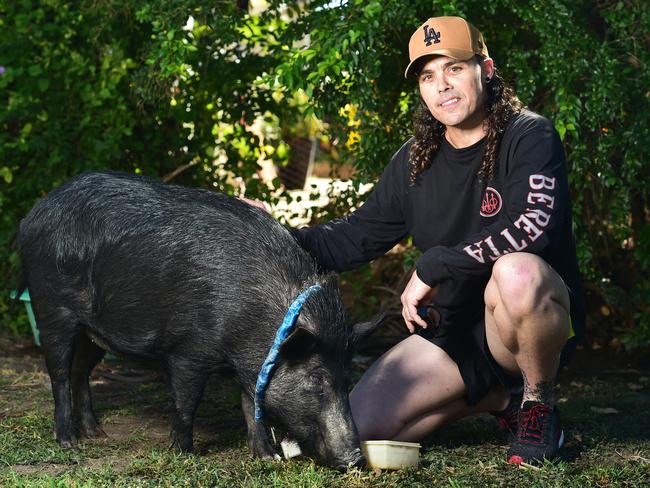 Daniel English with his pet Razerback pig, Missy. Picture: Shae Beplate.