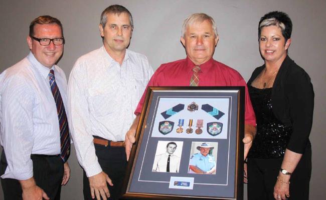 Gympie MP David Gibson, with Ray Pringle, Vic Tipman and Ann MacDonald helped mark the occasion with a handover of memorabilia from Mr Tipman’s career. Picture: David Crossley