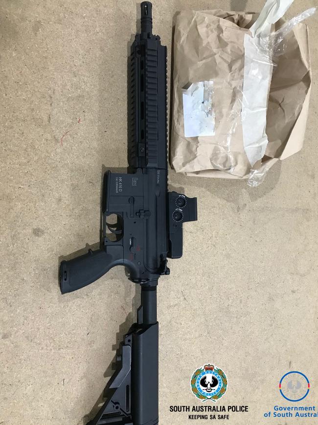 The gun and magazine found at one man’s home. Picture: SA Police