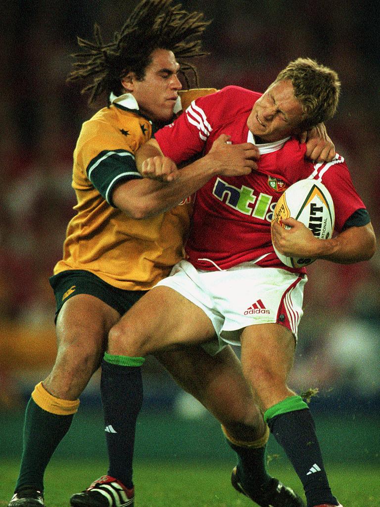 George Smith goes at it with Jonny Wilkinson in 2001.