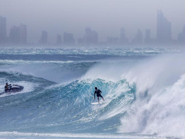 Surfers descend on Kirra as tropical cyclone Oma brings big swell. Picture by Luke Marsden.