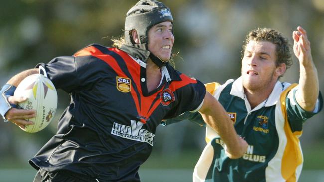 MAY 02, 2004: Group 18 Tigers v Cudgen at Owen Park Southport. Tigers Jay Doo breaks tackle of Cudgens Joel Scheimer. D/i PicGlenn/Hampson - rugby league sport