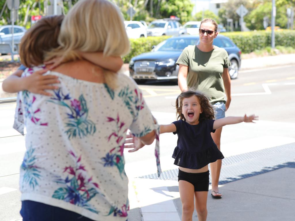 Codi McKay, 4, runs to greet her grandmother Vonnie Smith at Sunshine Coast Airport after she flew in from Melbourne. Picture: Lachie Millard