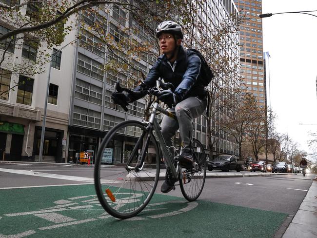 Victorian Transport Workers Union are calling on the government to wind back controversial bike lanes in Melbourne's CBD to help delivery drivers and improve the economy. Bike rider using the empty bike lanes in Exhibition street.                     Picture: David Caird