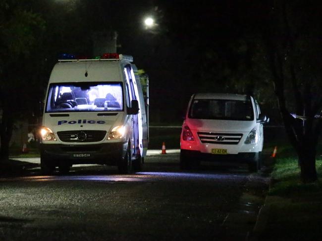 Police at the scene in Merino Street, Miller overnight. Picture: Bill Hearne