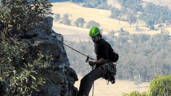 A KEEN abseiler makes the most of spectacular sandstone cliffs at Point Pure near Glastonbury.