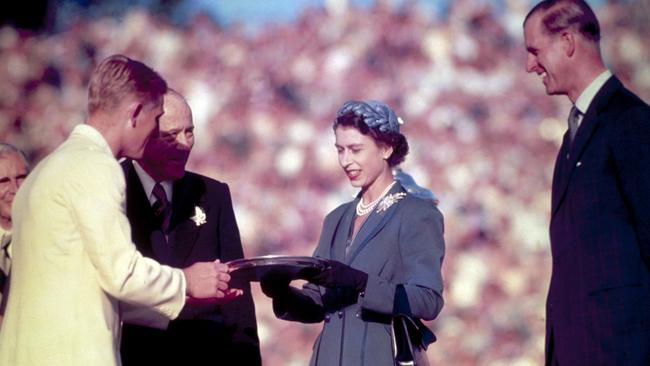 The Queen presents the Silver Salver to Australian tennis champion Lewis Hoad in Kooyong, 1954. Picture: Getty Images.