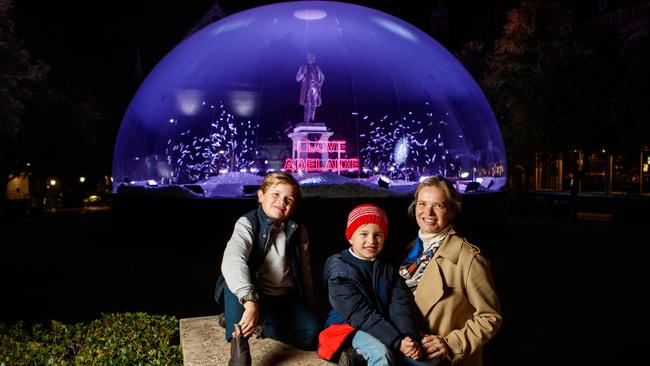 Georgie Duckworth with her sons Harrison 8 and Teddy 6 at the Illuminate Adelaide installation, I Love Adelaide by Jacques Rival at the University of Adelaide. Picture: Matt Turner.