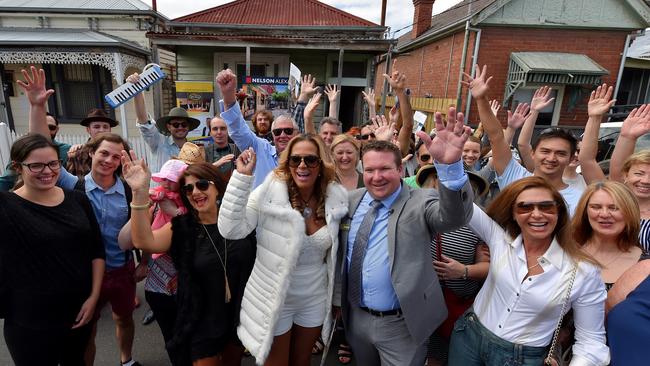 Beyonce impersonator Nelva Hewitt and auctioneer Steven James celebrate the sale with the crowd. Picture: Jay Town