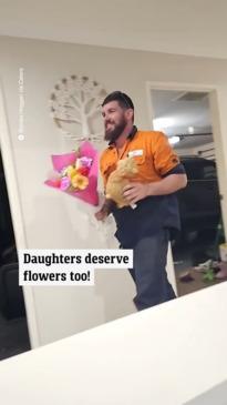 Dad surprises his daughter with flowers