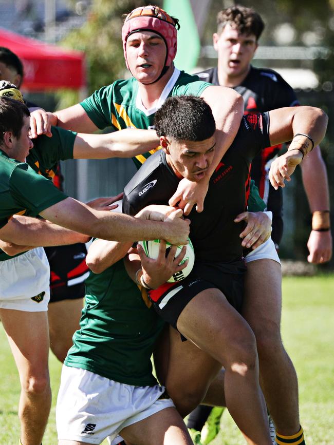 Endeavour SHS (black) playing against Farrer MAHS (Green) in round 1 of Peter Mulholland Cup at Woy Woy Oval. Picture: Adam Yip