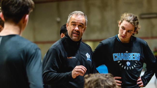 Hobart Chargers coach Anthony Stewart talks to his players during a time out. Picture: Linda Higginson