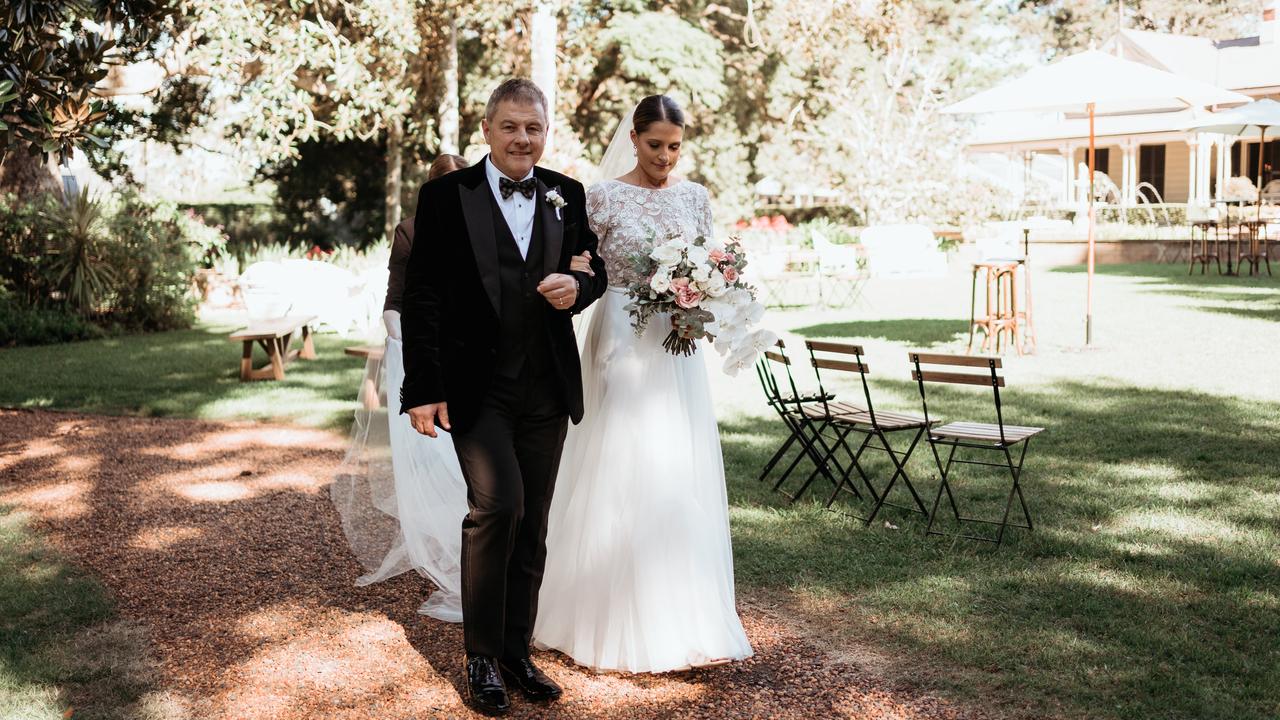 Jane Farrugia walking down the aisle. Picture: Feather and Finch Photogtaphy