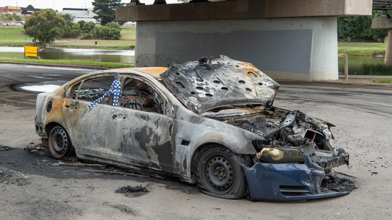 Burnt out car under a bridge. Picture: Brad Fleet