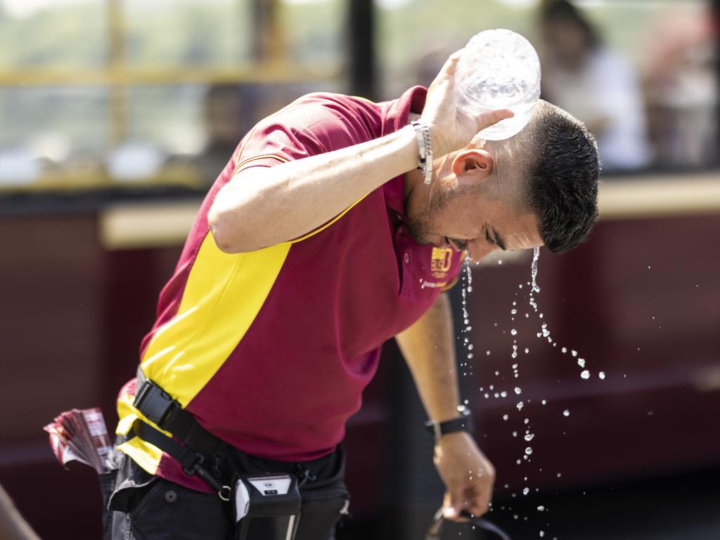 A man pours water over himself on Westminster Bridge in London. Picture: Getty Images