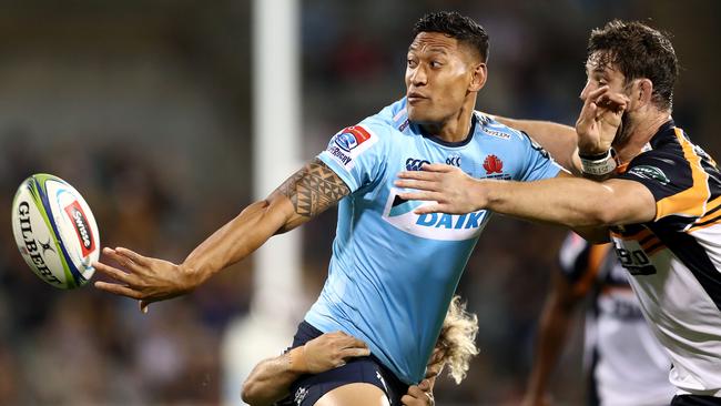 Waratahs winger Israel Folau offloads against the Brumbies on Friday night. Picture: Getty Images