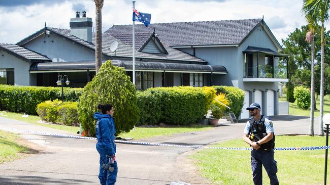 Police and forensic officers at Campbelltown Rd, Denham Court, after the alleged shooting. Picture: Julian Andrews