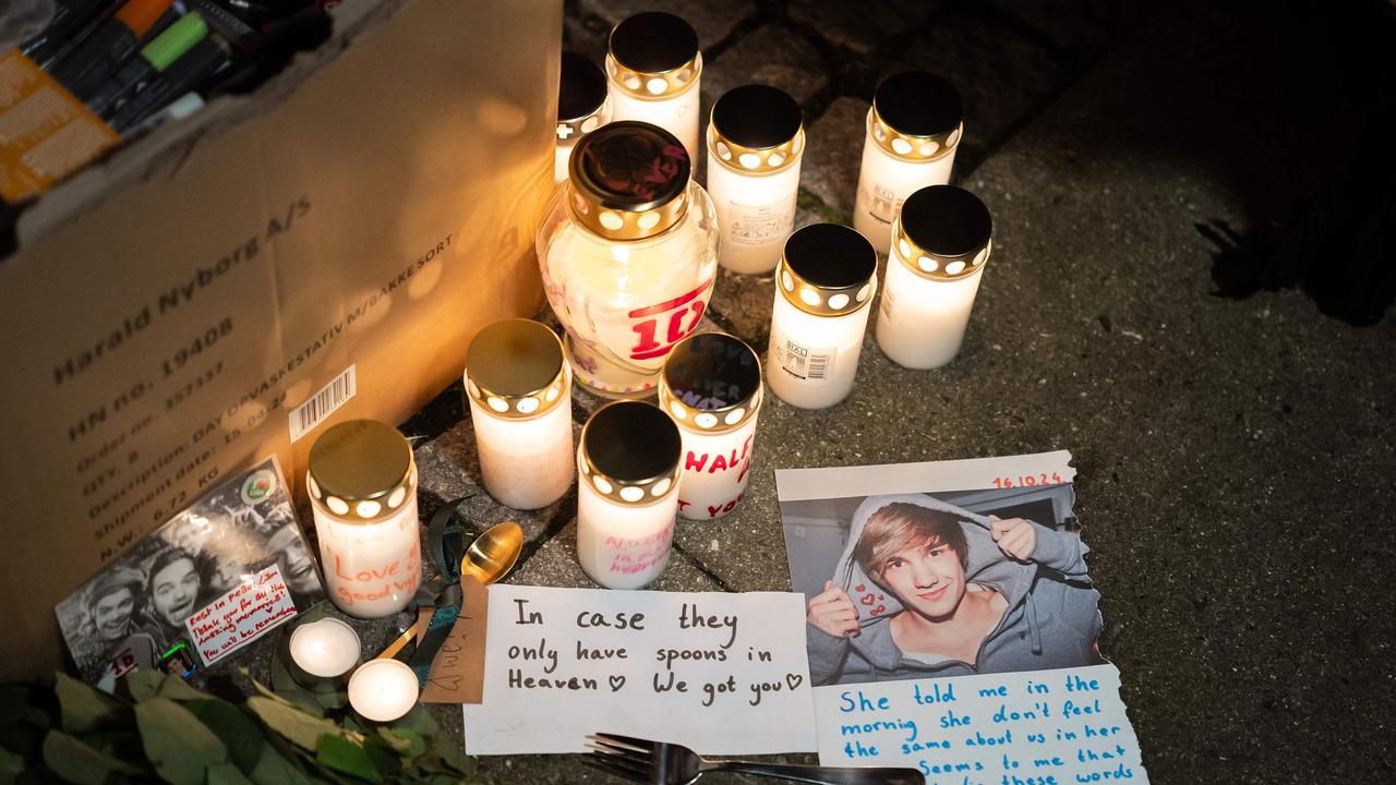 Handwritten notes, flowers and candles have been left in tribute to the singer. Picture: Emil Nicolai Helms / Ritzau Scanpix / AFP