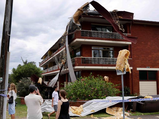 DAILY TELEGRAPH, DECEMBER 19, 2021: A A storm damaged roof that flew off a roof and landed on this apartment block near Pacific Parade at Dee Why Beach after a short wild windy storm ripped through the Northern Beaches.Picture: Damian Shaw