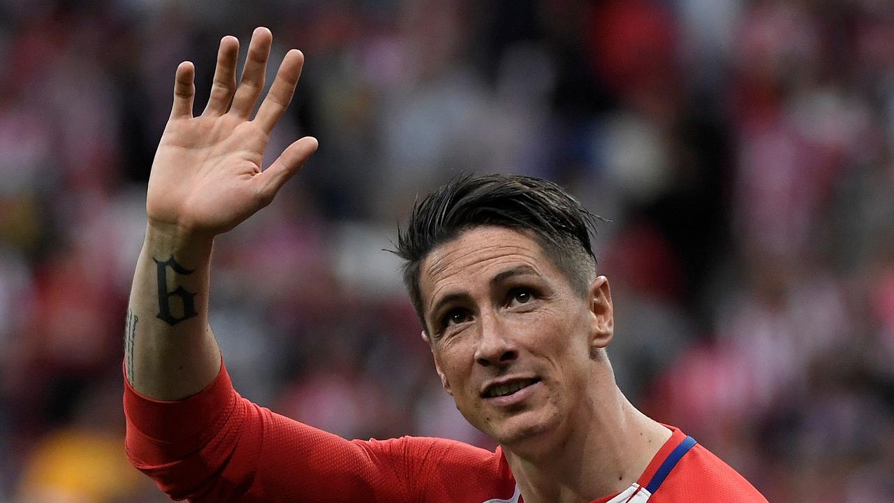 Atletico Madrid's Spanish forward Fernando Torres waves at fans