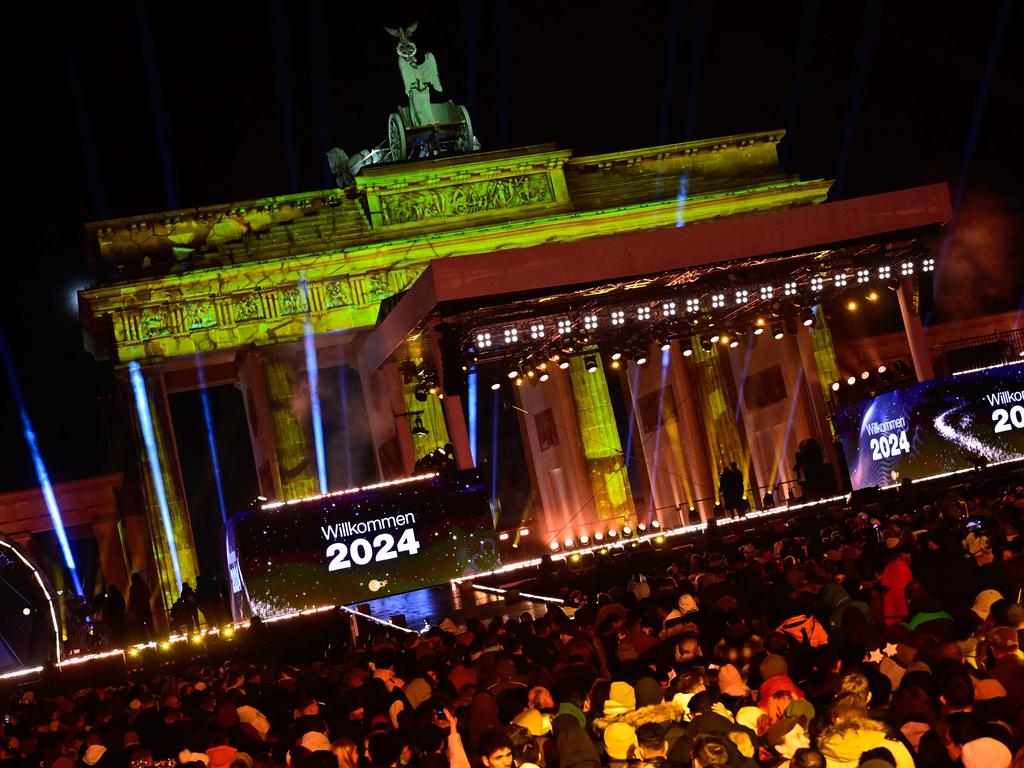 The lettering ‘Welcome 2024’ is displayed on a digital board during the New Year party in front of the landmark Brandenburg Gate in Berlin. Picture: AFP