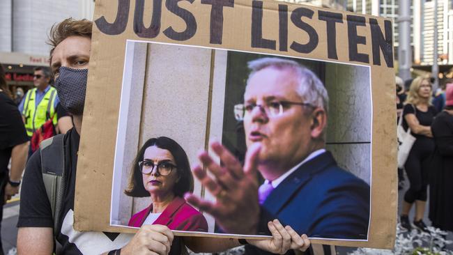 A person holds up a sign at Town Hall during the Sydney march. Picture: Jenny Evans/Getty Images