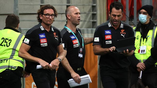 Mark McVeigh (middle) brought in old Essendon mates James Hird (left) and Dean Solomon to help him as the Gants’ caretaker coach. Picture: Phil Hillyard