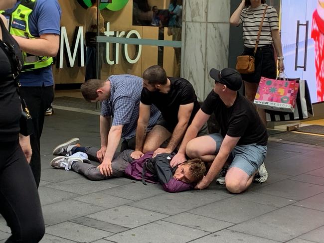 Three men performed a citizens arrest on a fourth in Pitt St in Sydney, today. Picture: Supplied