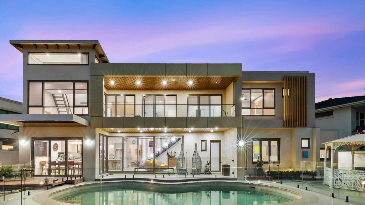 A view of the updated pool and rear of the property.