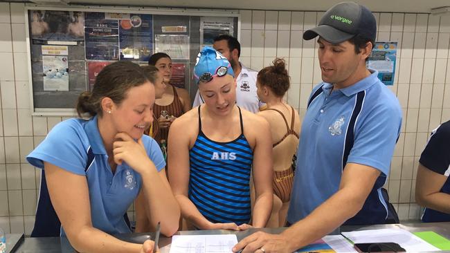 Newmarket Racers swimming coach Steve Miller, right, is also the head coach of the champion All Hallows' School swimming squad.