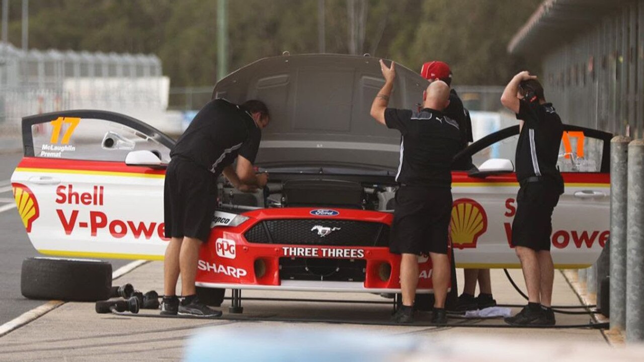 The team checks over the new car on Monday. Picture: Matthew Paul Photography