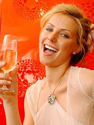 30 Oct 2004 Derby Day Fashion at Flemington - Miss Universe, Jennifer Hawkins - headshot profile glass white wine?