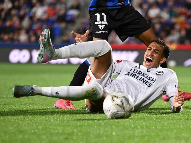 Nishan Velupillay shows his anguish after suffering a leg injury at Go Media Stadium on Saturday night. Picture: Hannah Peters/Getty Images