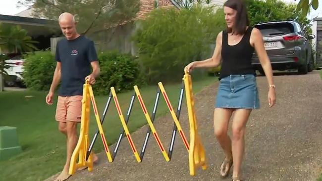 They’ve had to resort to putting up a sign and safety barrier to stop people from knocking on their door. Picture: 9News