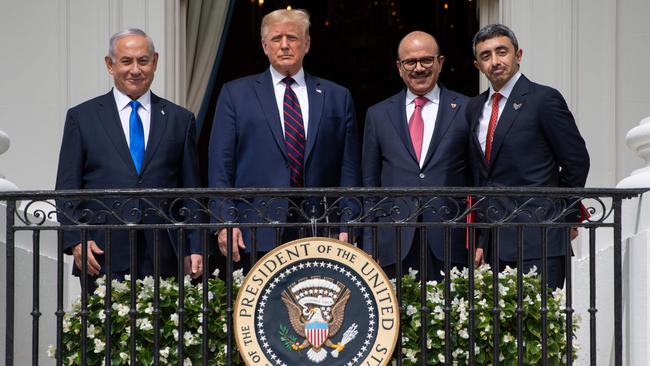 (L-R) Israeli Prime Minister Benjamin Netanyahu, US President Donald Trump, Bahrain Foreign Minister Abdullatif al-Zayani, and UAE Foreign Minister Abdullah bin Zayed Al-Nahyan pose from the Truman Balcony at the White House.