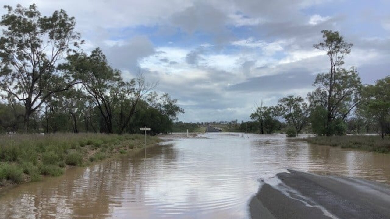 Floodwaters over the Gregory Highway near where a man died after his ute was submerged. Picture: QPS